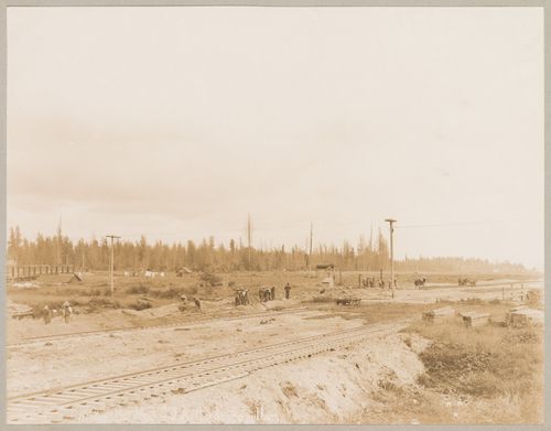 View of the Canadian Pacific Railroad Company freight yards under construction showing workers and train, Coquitlam (now Port Coquitlam), British Columbia