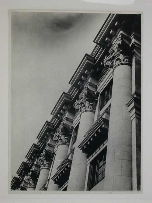 Close-up view of the entablature, Corinthian capitals, and columns of the principal façade of an apartment building, 16 Mokhovaia Street, Moscow