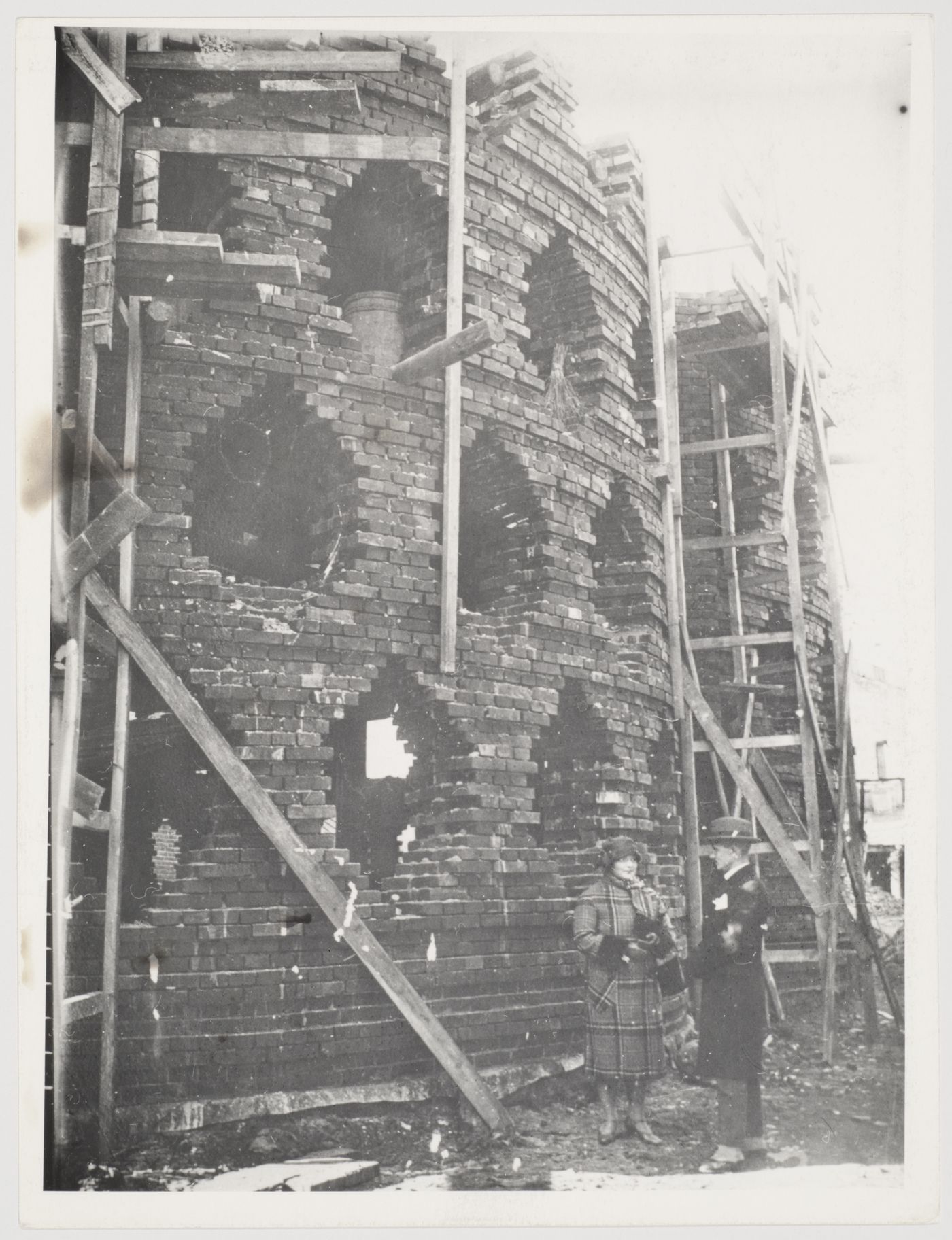 View of the Melnikov residence under construction showing Melnikov and his wife, Moscow