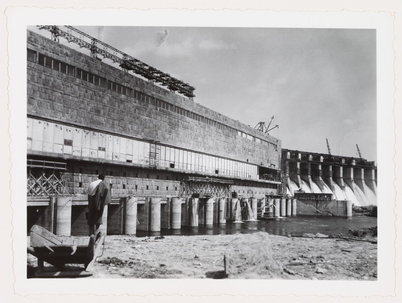 View of Dnieper Hydroelectric Power Station showing the sluice and turbine building under construction and the dam in the background, Zaporozhe, Soviet Union (now in Ukraine)