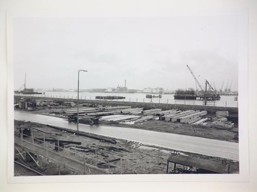 View of steel beams used for construction of power station, by river, United Kingdom