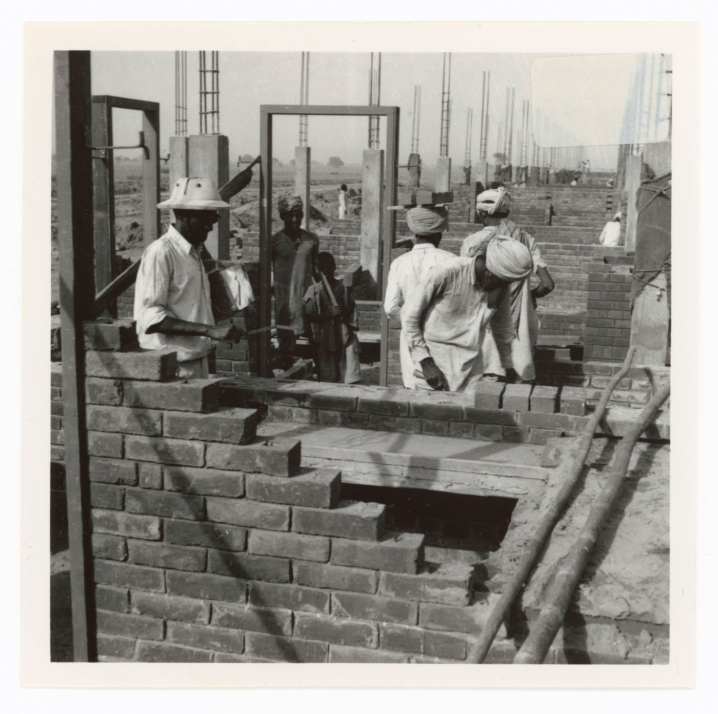 View of workers and houses under construction, Sector 22, Chandigarh, India