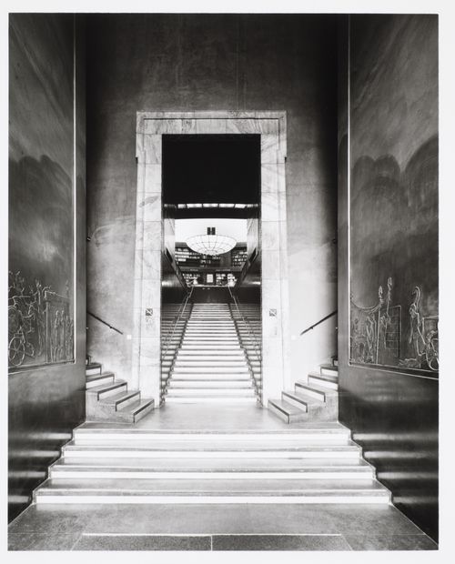 Interior view of the stairs leading from the lobby to the lending hall of Stockholm Public Library showing the bas-reliefs depicting scenes from the Iliad sculpted by Ivar Viktor Johnsson, 51-55 Odengatan, Stockholm, Sweden