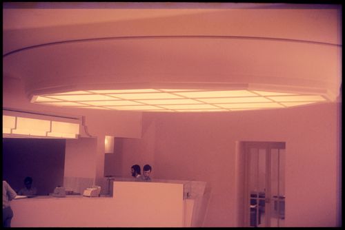 View of four men and interior of Banco Pinto & Sotto Mayor, agência e clube, Lamego, Portugal