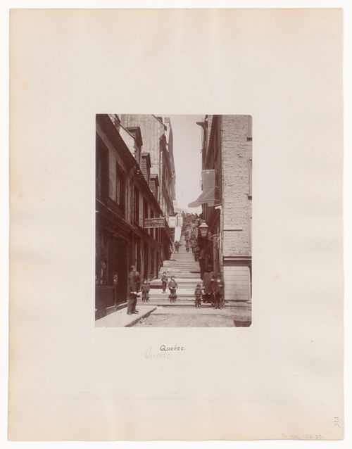 "Sous le fort": View of street with steps leading up, figures outside, Québec, Québec