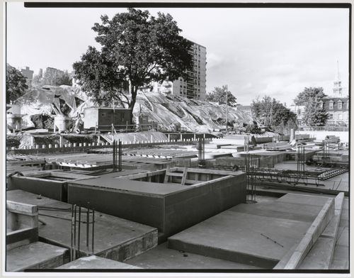 View of the construction site from the west with an apartment house and a construction workers' trailer in the background, Canadian Centre for Architecture under construction, Montréal, Québec