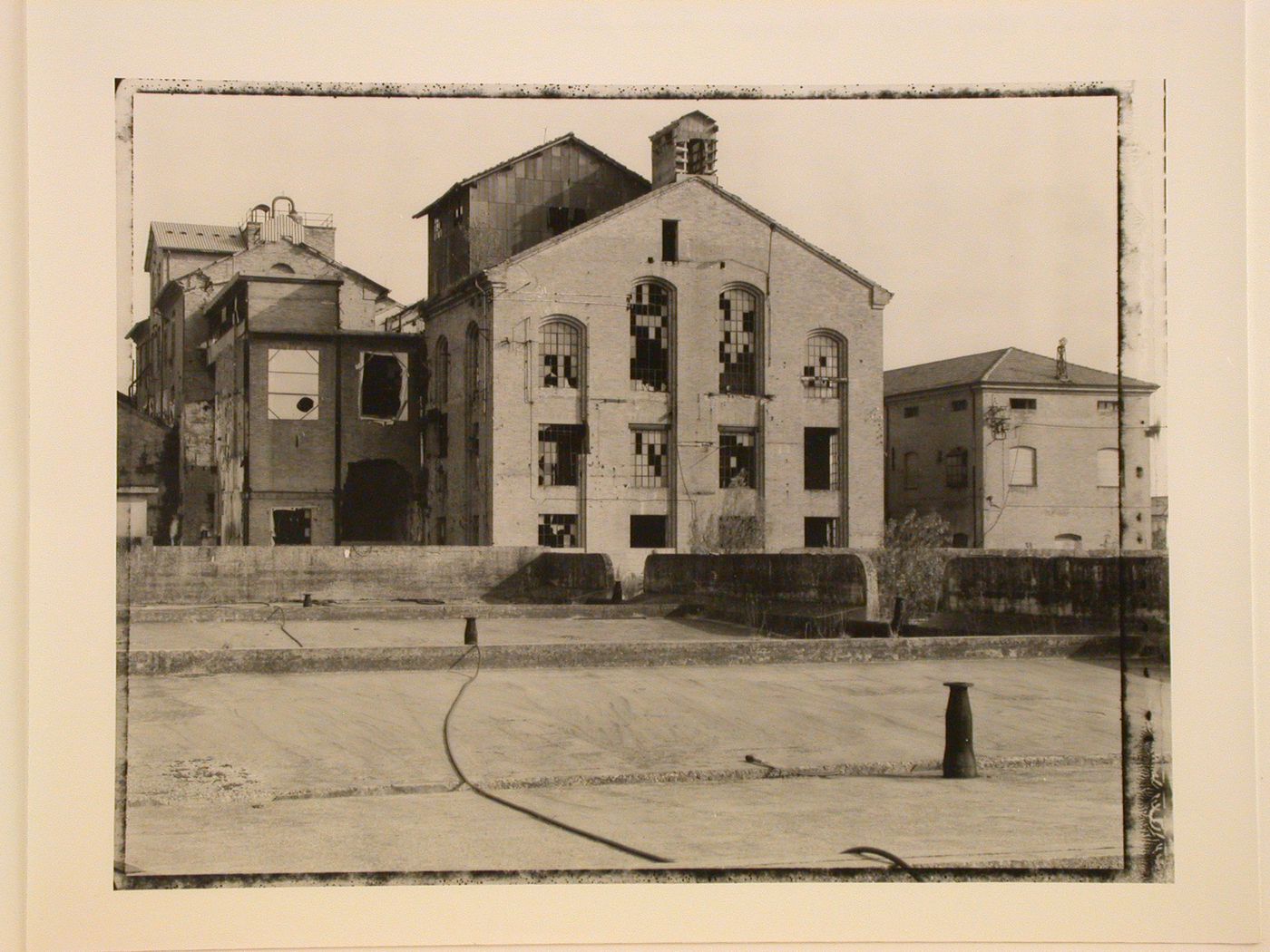 Exterior view of old factory building with broken windows in Eridania, Ravenna, Italy