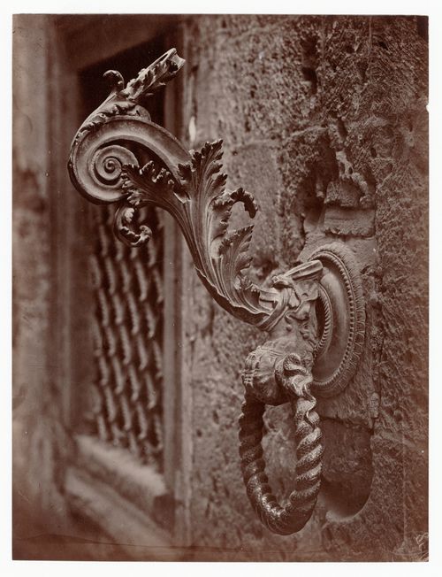 Close-up view of a torch holder beside [?] the Porta Bandiera in the Palazzo del Magnifico, Siena, Italy