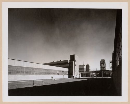 View of the principal façade of a warehouse with the Coagulation Building in the background, B.F. Goodrich Company Geon Plant, Louisville, Kentucky