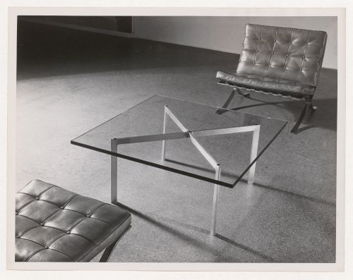 View of Barcelona chairs and an X table