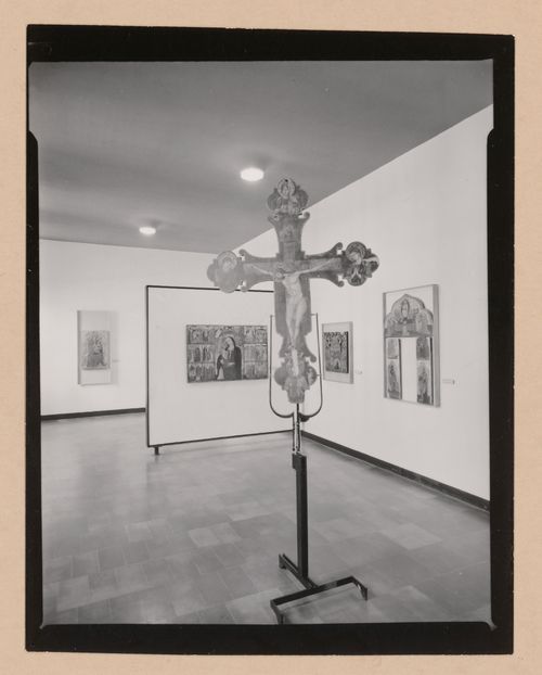 Interior view of a gallery showing a freestanding painted crucifix and paintings, Museo Correr, Venice, Italy