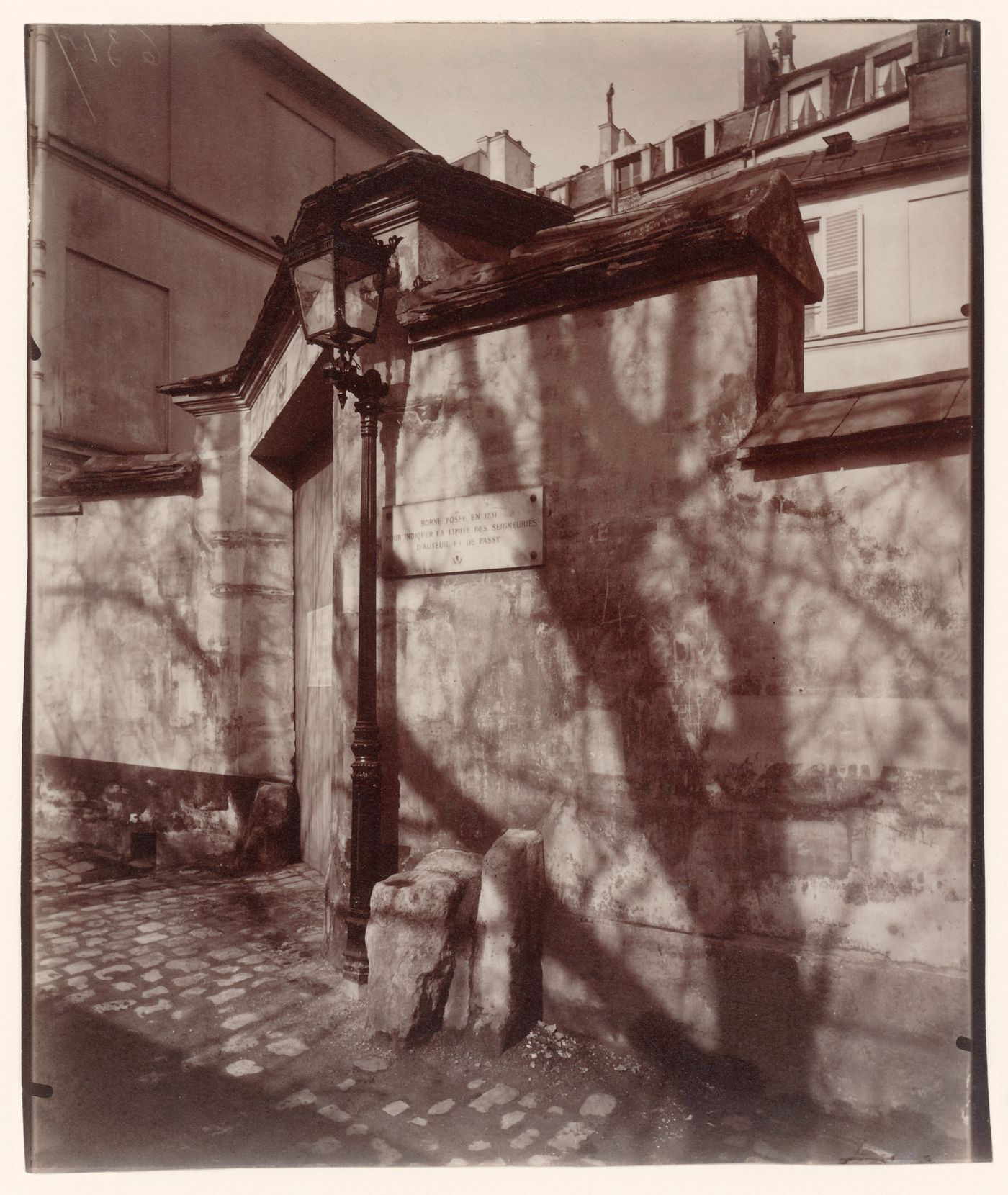 Maison de Balzac, showing front entrance in wall, street lamp and tree shadows, Paris, France