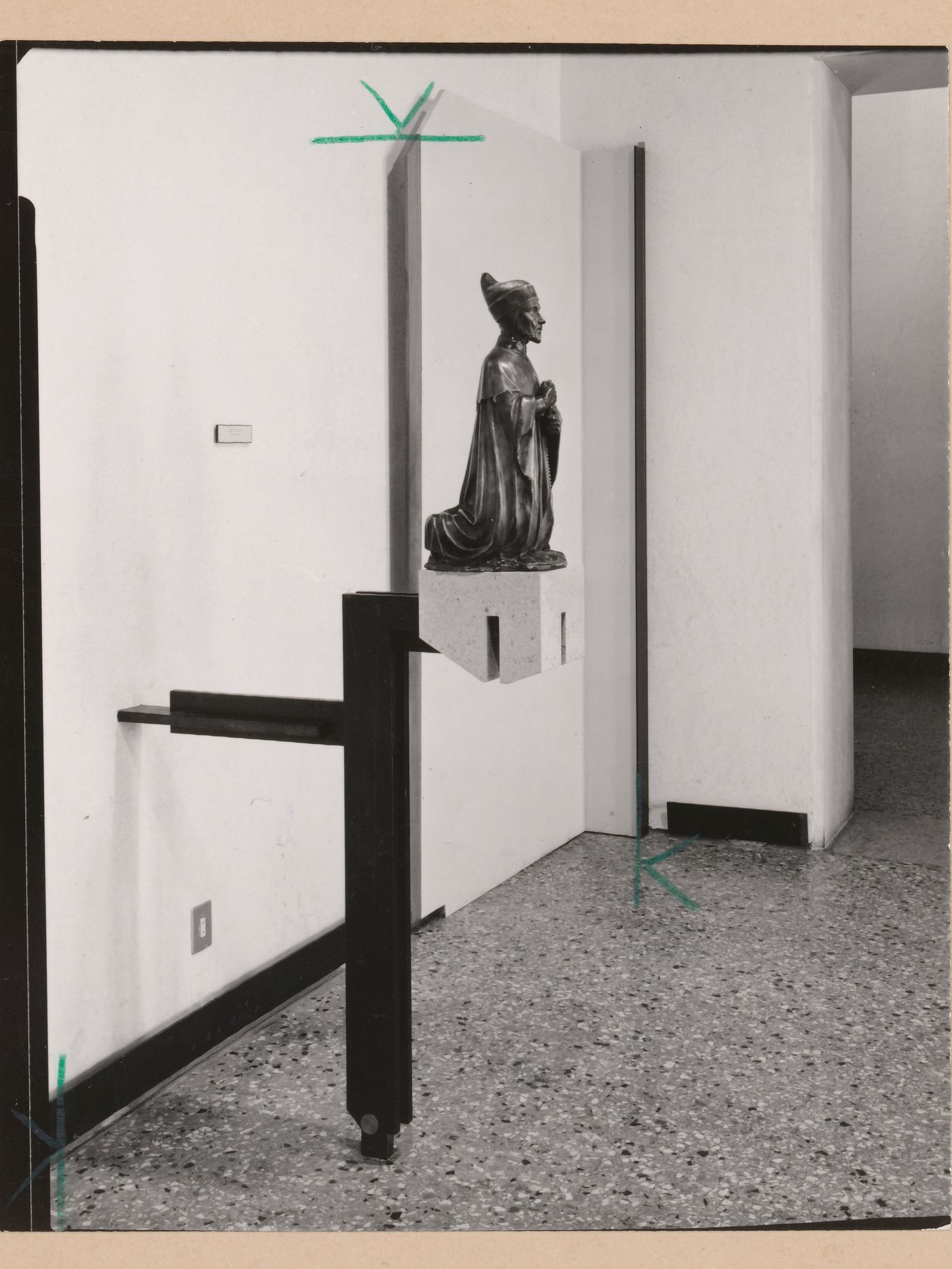 Interior view of a gallery showing a sculpture of a kneeling man, Museo Correr, Venice, Italy
