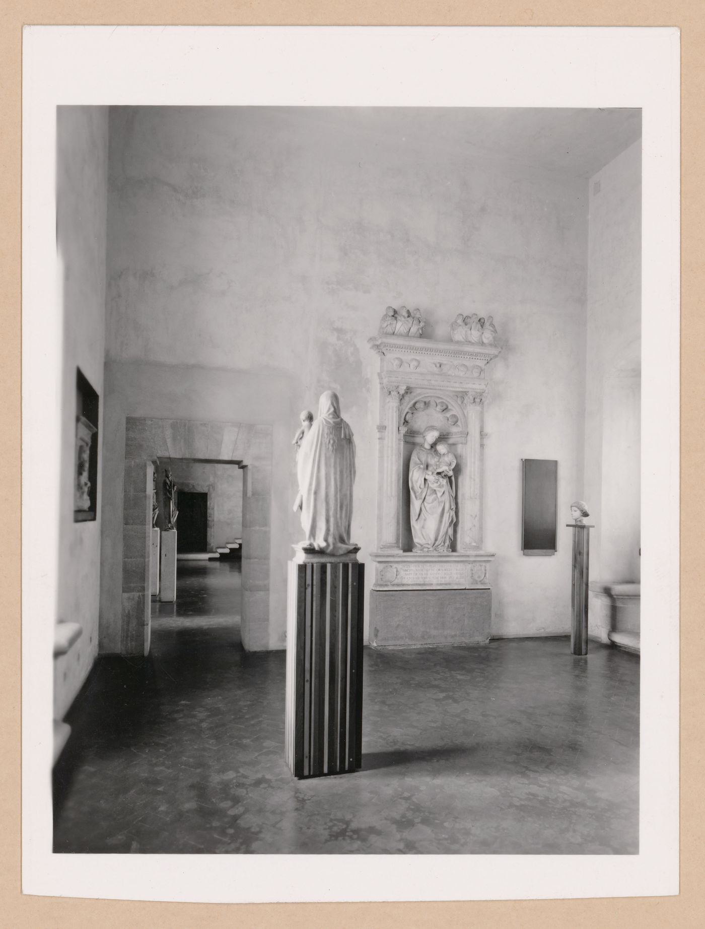 Interior view of the Sala dei Gagini showing sculptures with the Sala della scultura in the left background, Palazzo Abatellis, Galleria regionale della Sicilia, Palermo, Italy