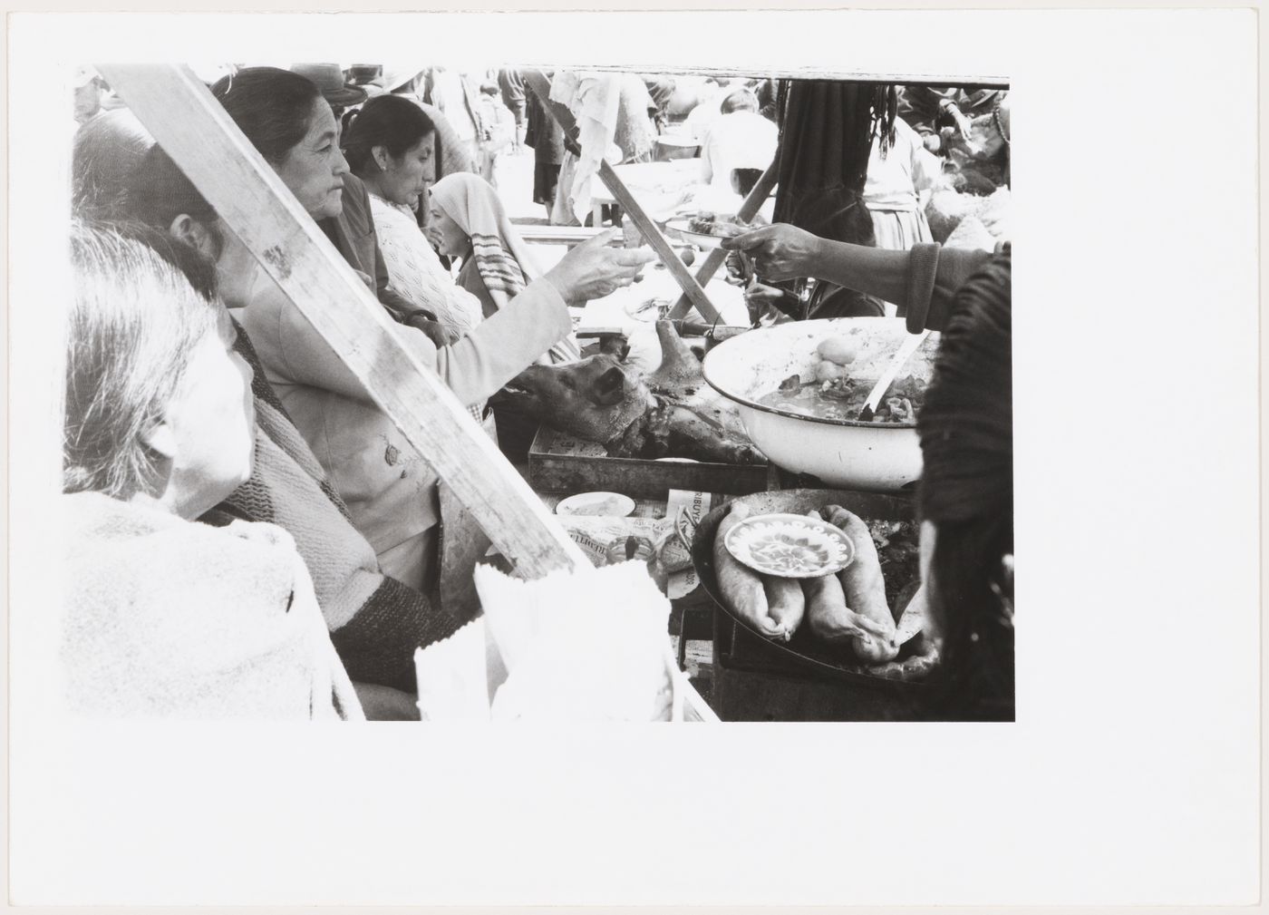 People and food in a market, South America