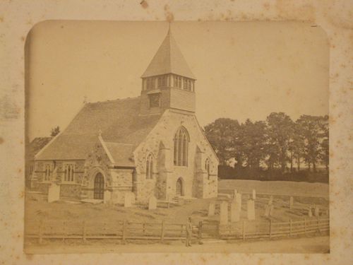 View of the west and north façades of the Church of All Saints showing its cemetery, Whiteparish, Wiltshire, England