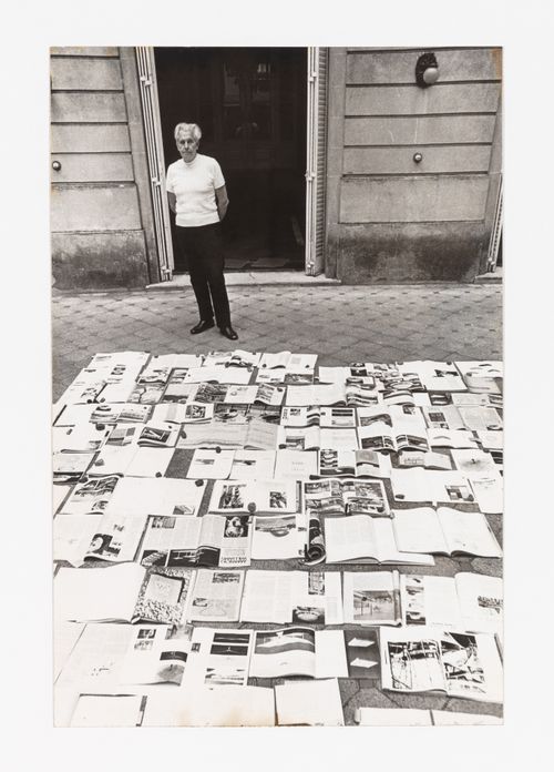 Photograph of Amancio Wiliams with publications featuring his work