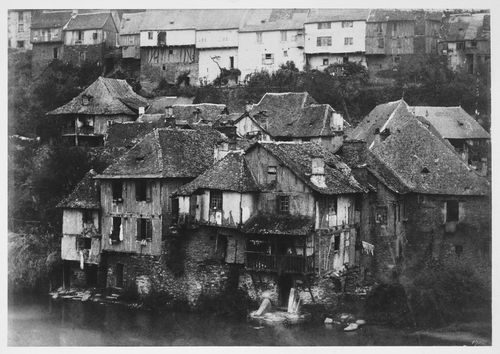 Group of houses by waterside, France
