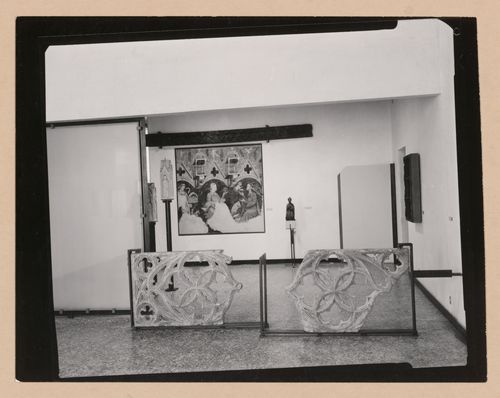 Interior view of a gallery showing fragments of stone tracery, a painting and sculpture, Museo Correr, Venice, Italy