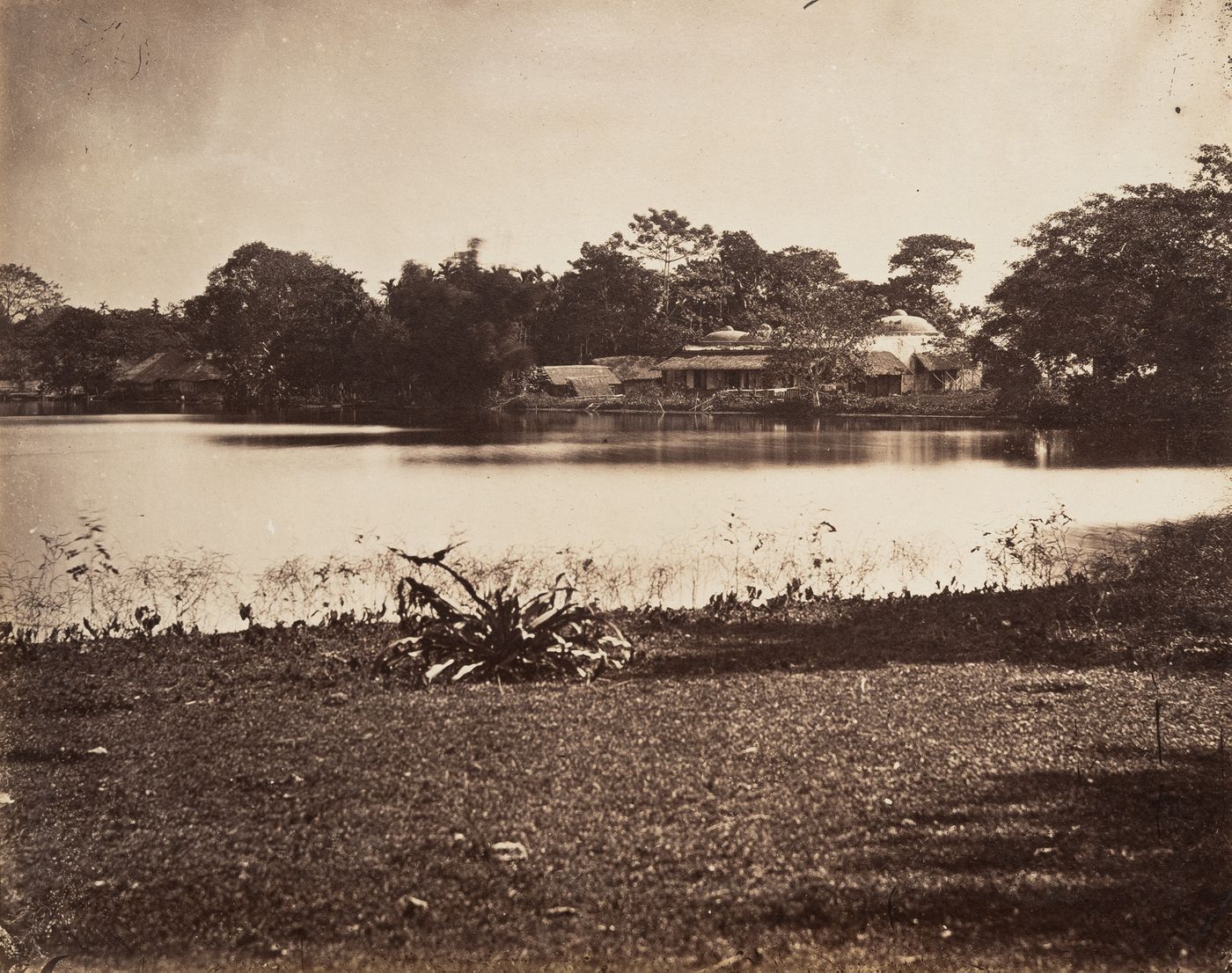 View of a village, showing a mosque ? and a water tank, Sylhet, India (now in Bangladesh)