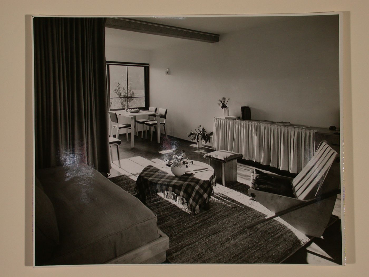Interior view of furnished living and dining rooms in a two storey duplex