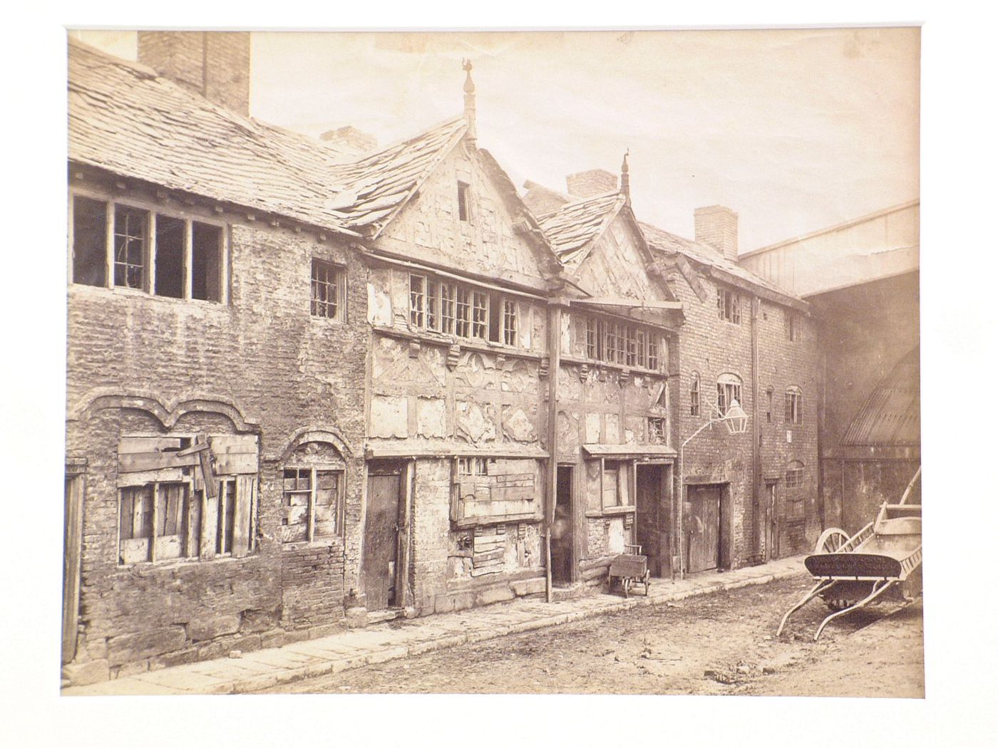 View of dilapidated houses on narrow street, Manchester, England
