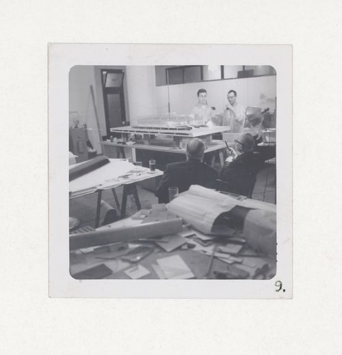 Interior view showing Mies van der Rohe, Ludwig Hilberseimer and two unidentified assistants with a study model for the competition for the Mannheim National Theatre, Germany