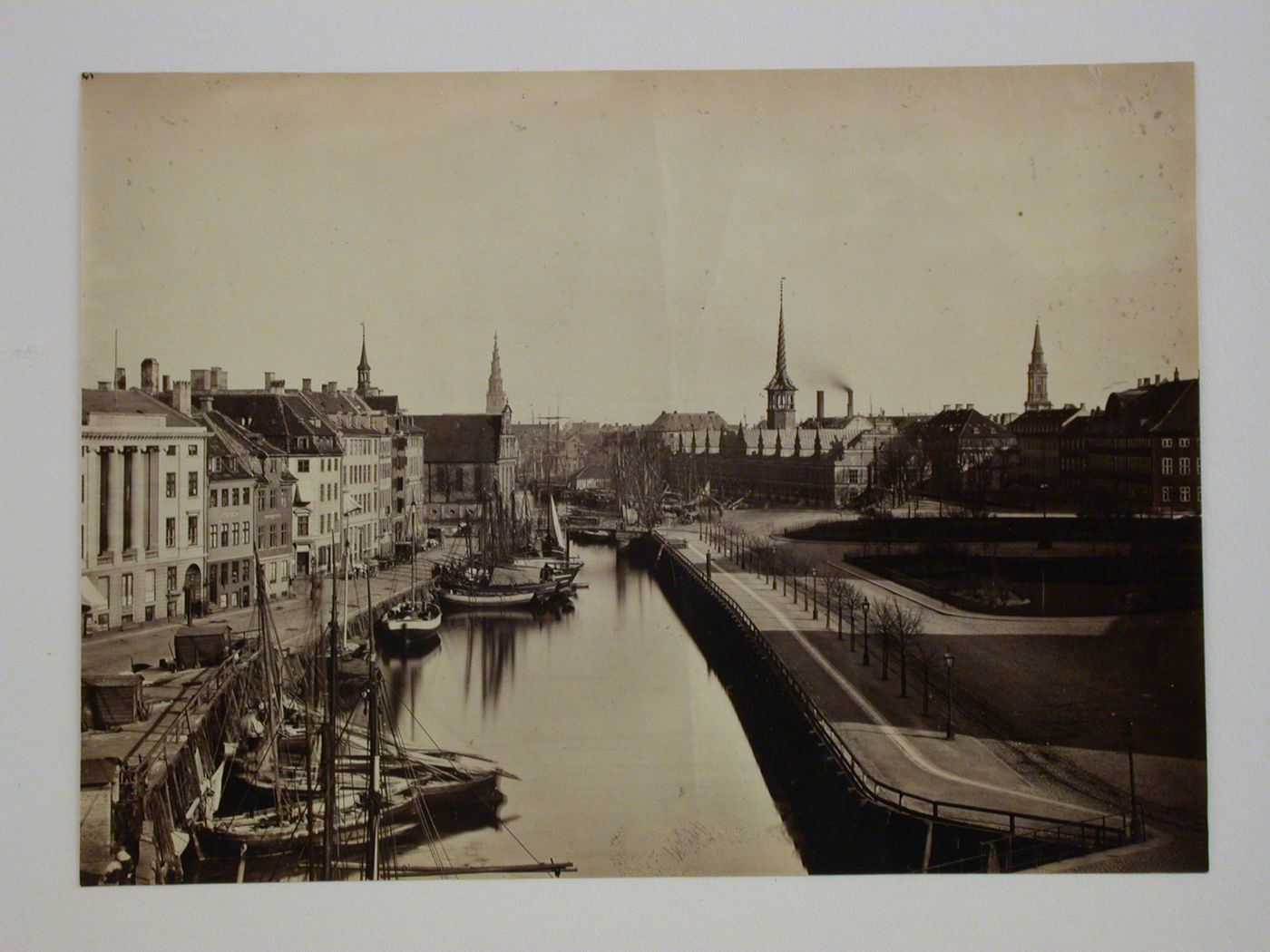 View of buildings along canal looking towards the old Stock Exchange (Borsen) and Von Frelsers Kirke, Copenhagen, Denmark