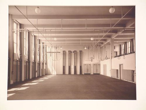 Interior, view of school gymnasium with rings suspended from ceiling, Cologne, Germany