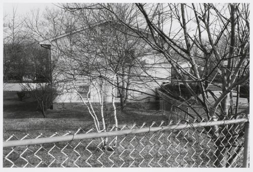 View of suburban house and wire fence, Ramapo, New York, United States