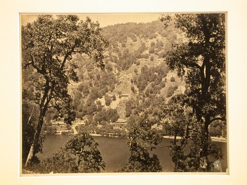 View of a hill and buildings with a lake in the foreground, Naini Tal, Uttar Pradesh, India