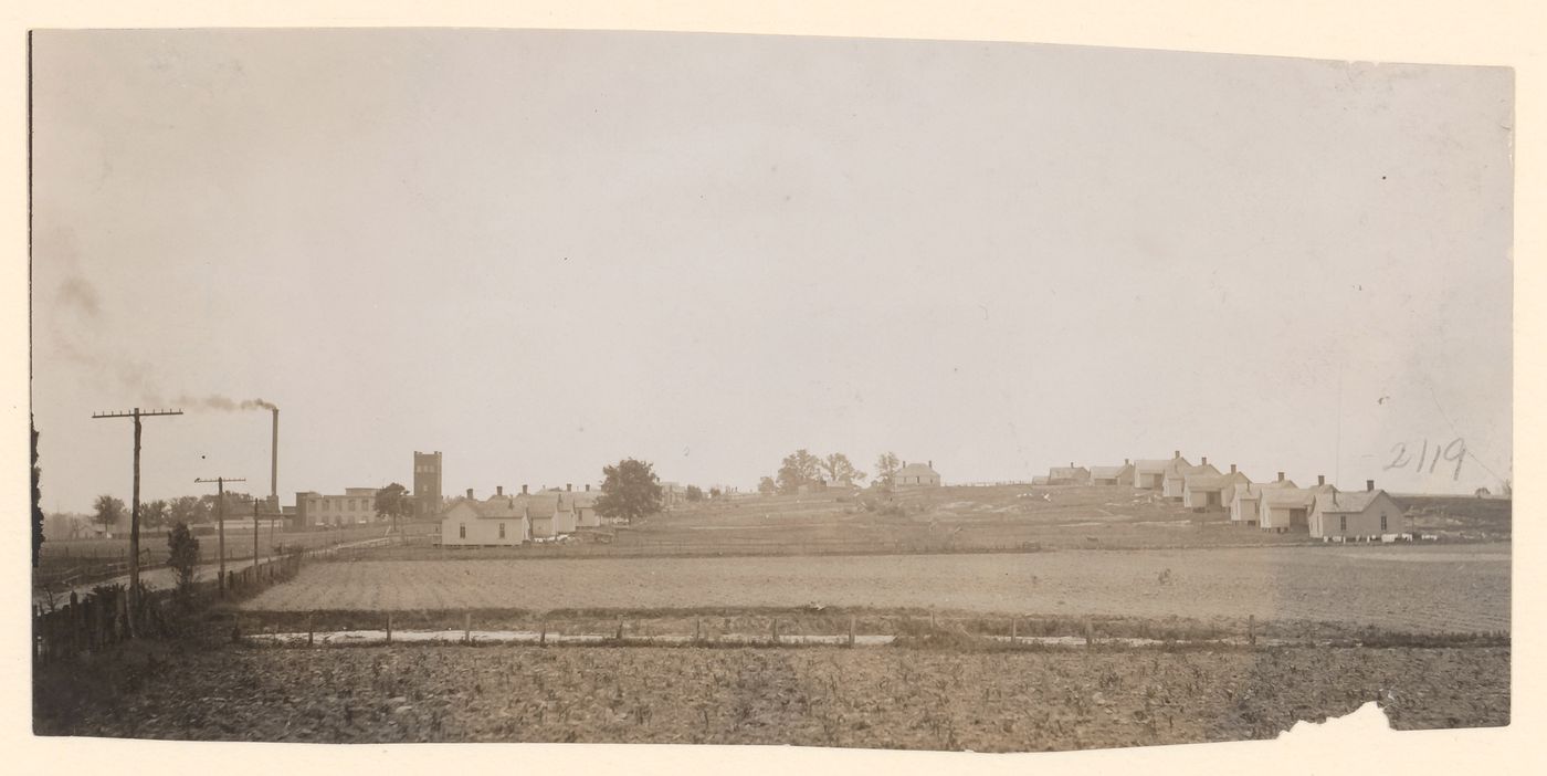 Fields in foreground, houses on hill, Hill Village, Mississippi