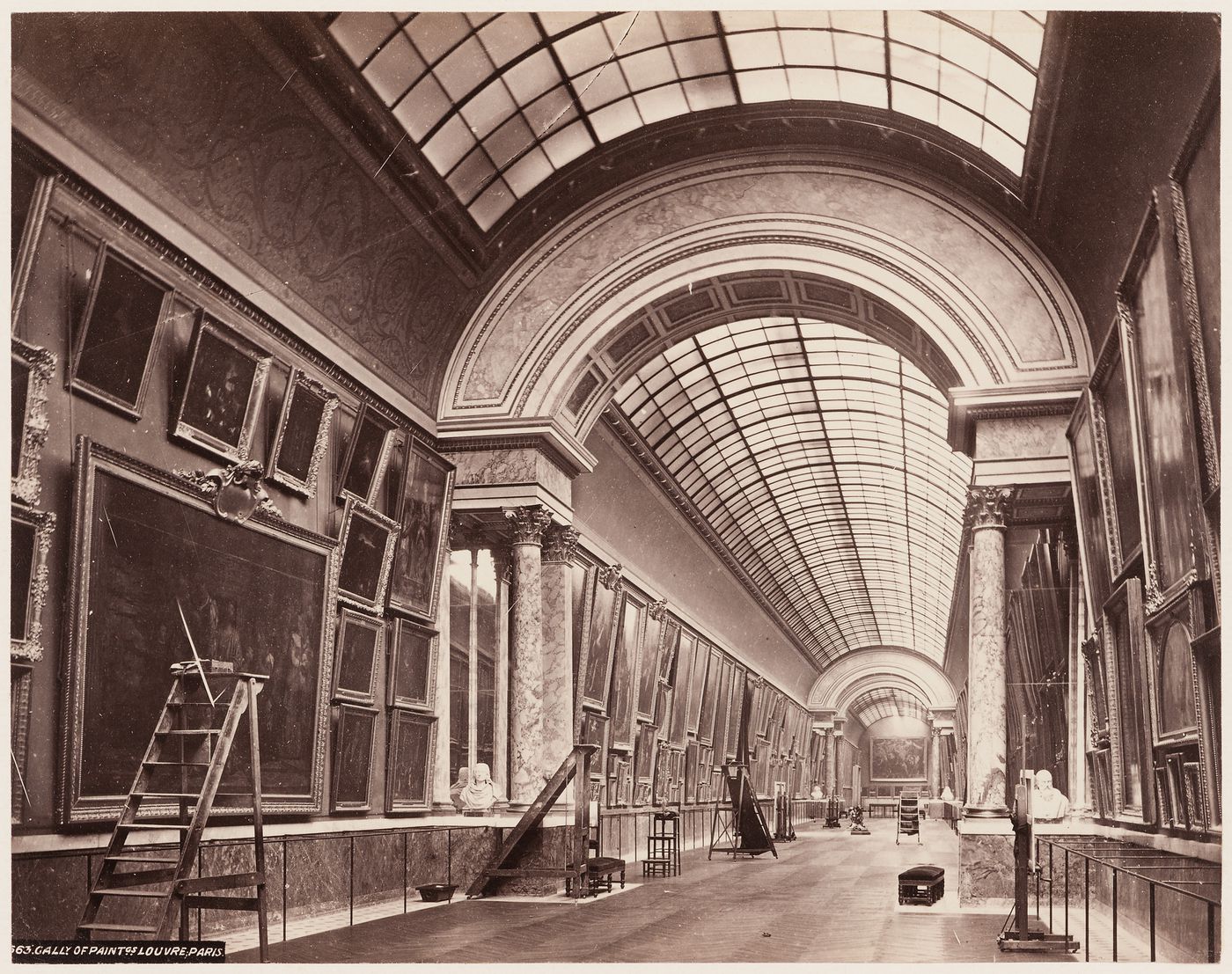 Interior of gallery of paintings, Louvre, with ladders, Paris, France
