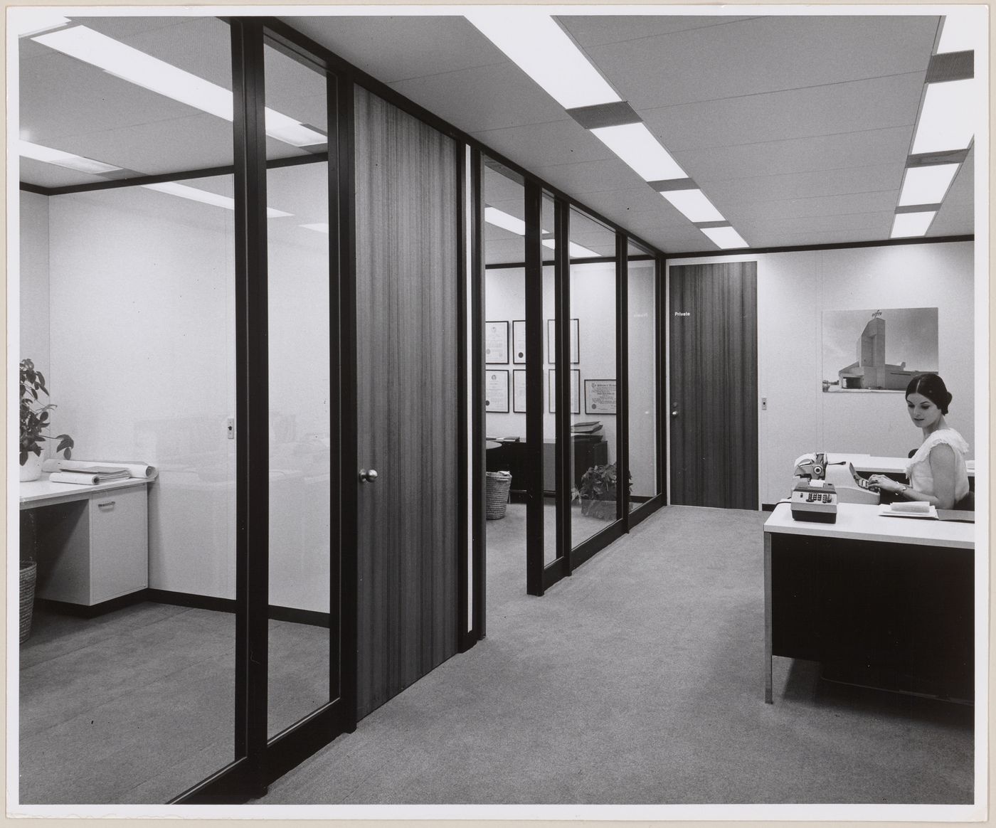 Interior view of John B. Parkin Associates office building with employee at desk, possibly Montreal office
