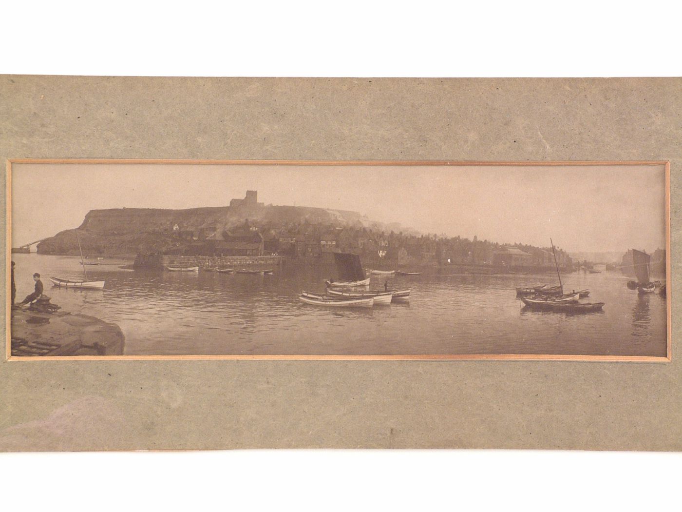 Panoramic view of town by shore, Whitby Harbour, Whitby, England