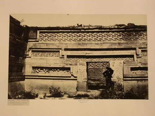 Interior view of the courtyard of the Palace of the Columns showing a man standing at a entrance, Mitla, Mexico