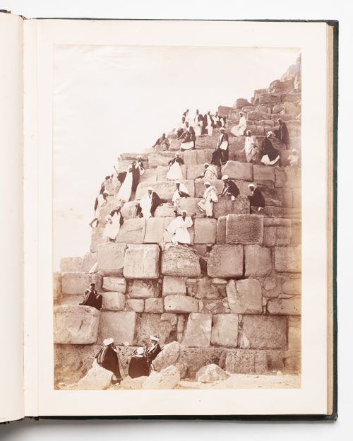 View of people climbing down the Great Pyramid, Giza, Egypt