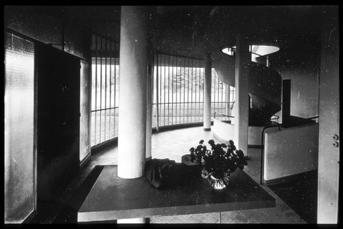 Interior view of the entrance hall showing the spiral staircase and pilotis, Villa Savoye, Poissy, France