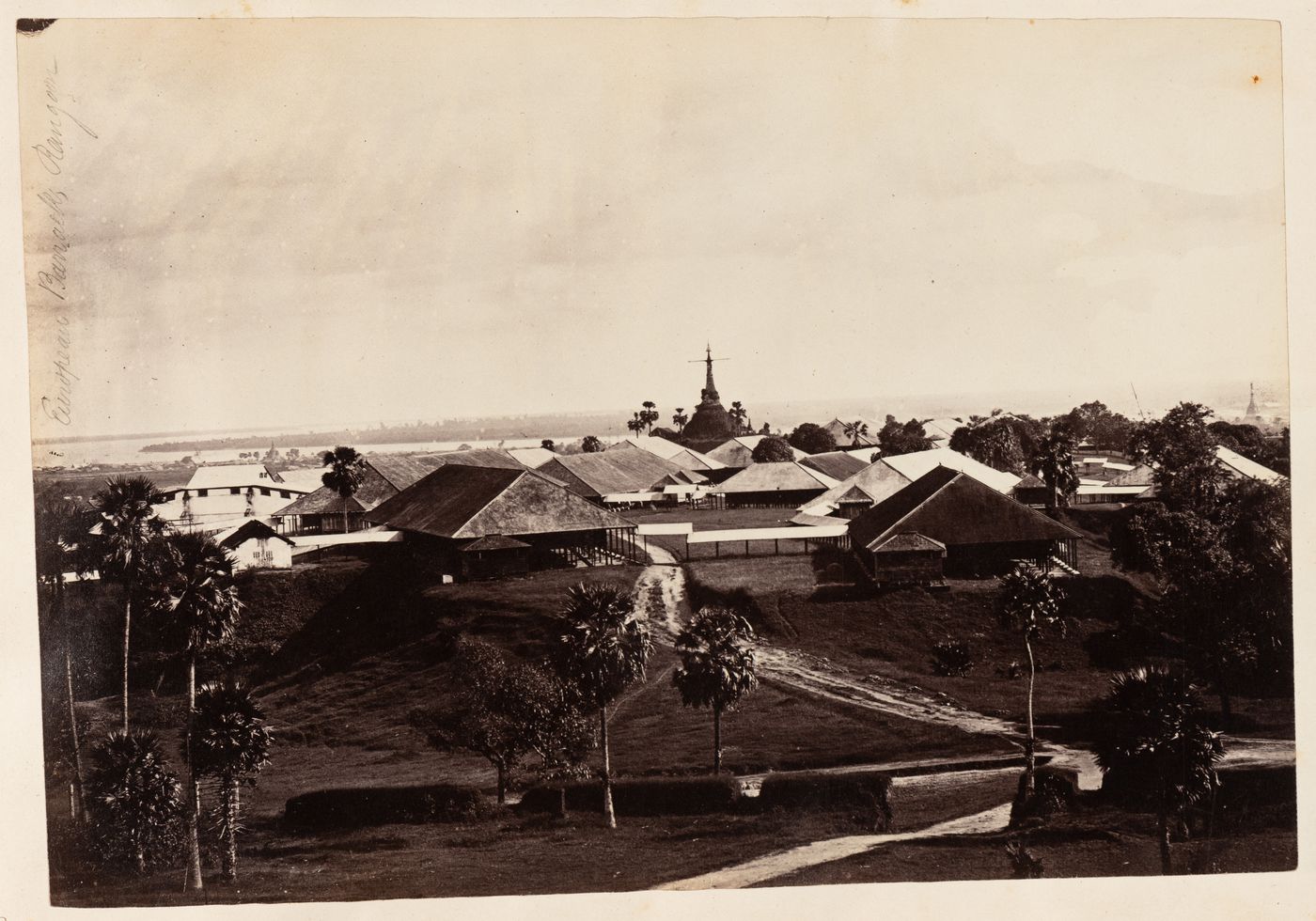 View of houses with a stupa and a river in the background, Rangoon (now Yangon), Burma (now Myanmar)