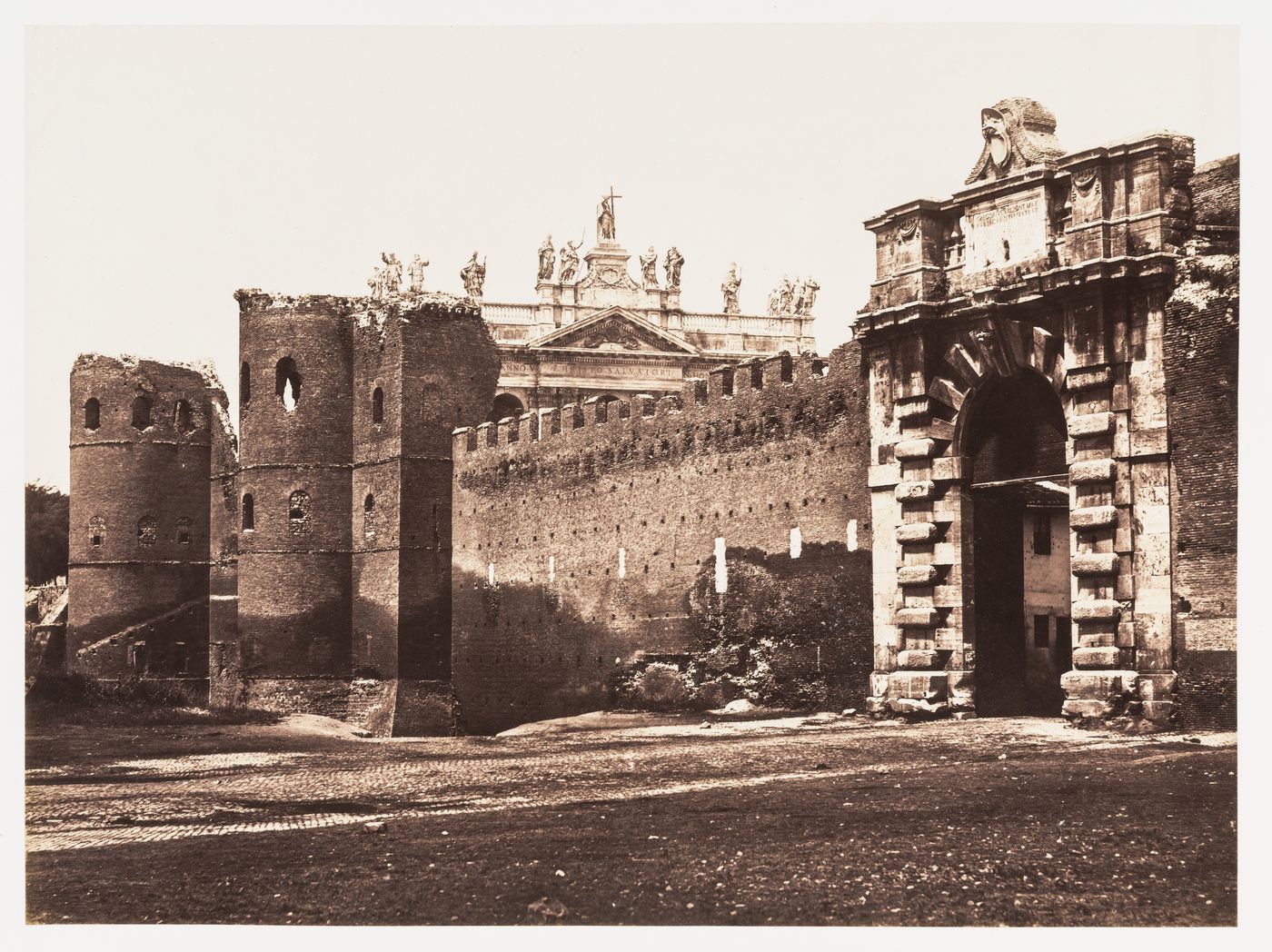 View of the Porta San Giovanni and the Aurelian Wall with the Basilica di S. Giovanni in Laterano in the background, Rome, Italy