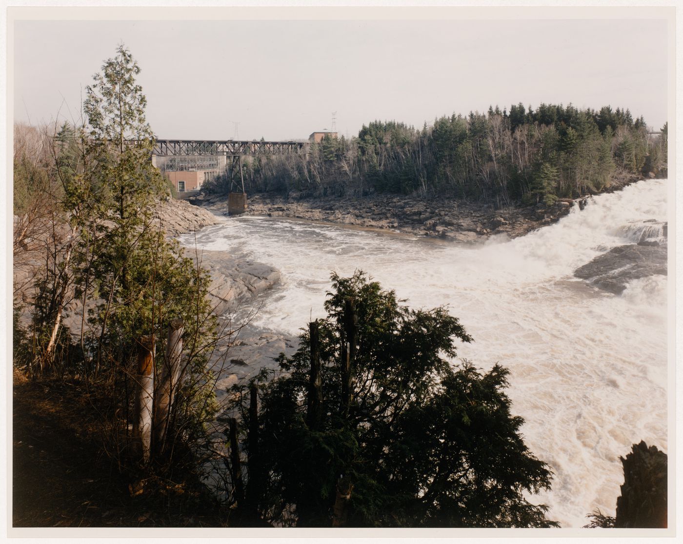 Section 1 of 2 of Panorama of Shawinigan Falls, looking north, showing gorge, Shawinigan 3 power station, Canadian Pacific bridge, spillway, and Melville Island