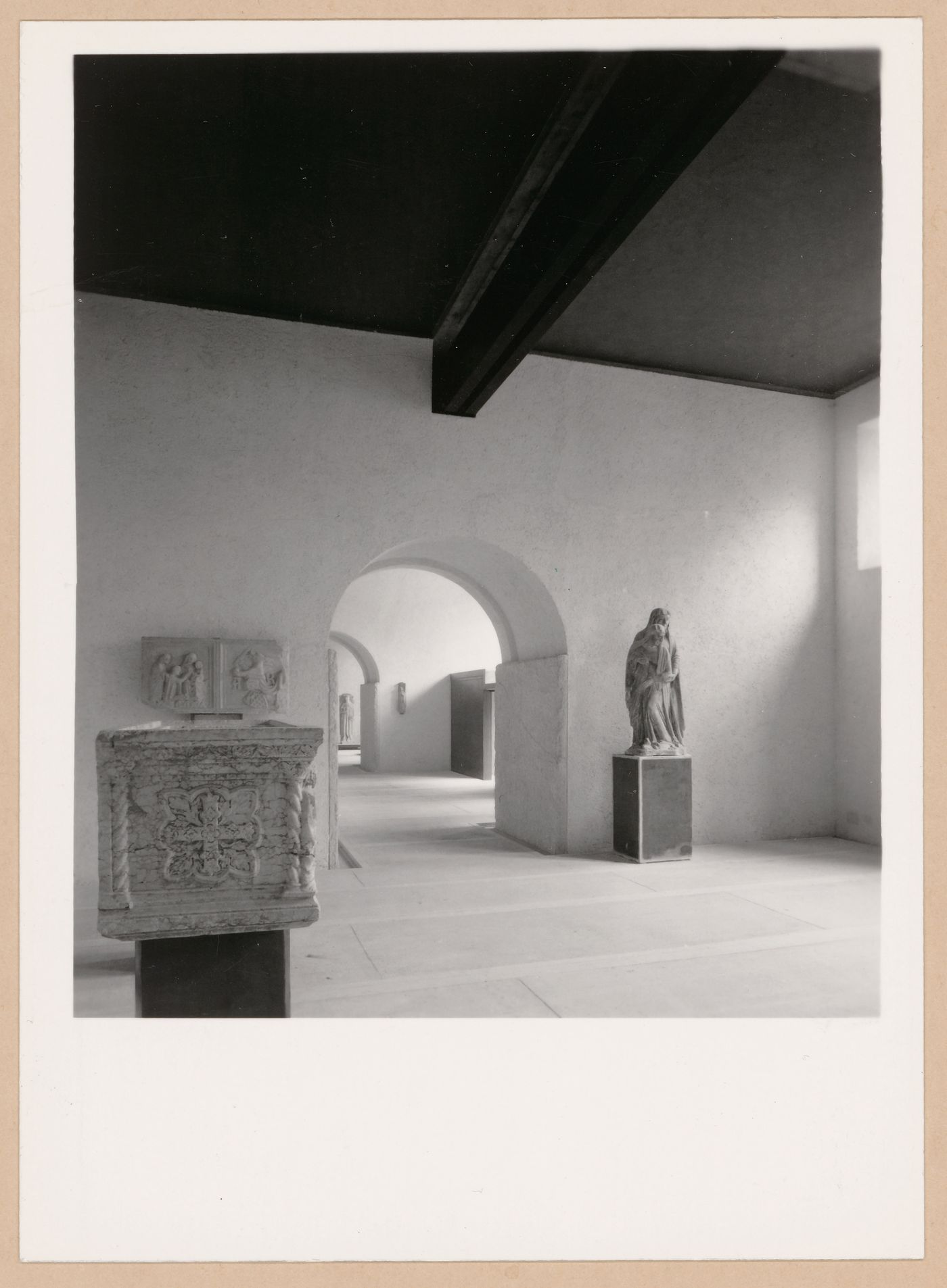 Interior view of a gallery showing a statue and reliefs, Museo di Castelvecchio, Verona, Italy