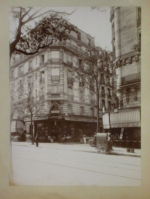 View of cafés, a store and apartment houses, 28 rue Secrétan at Impasse Monferrat, Paris, France