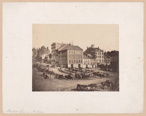 View of Market Square showing horses with carts and mercantile buildings, Saint John, New Brunswick, Canada