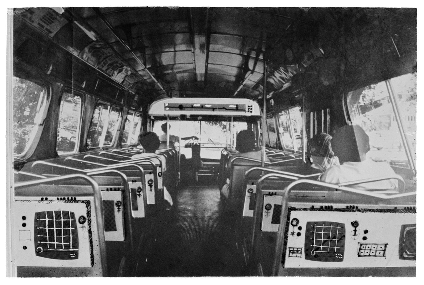 Atom: interior of bus showing seats equipped with electronic display devices