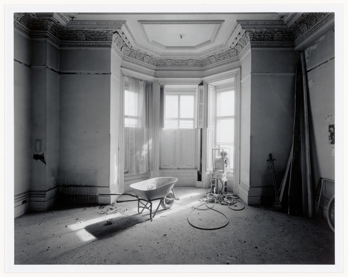 Interior view of the drawing room, showing a bay window, in the west part of Shaughnessy House under renovation, Montréal, Québec
