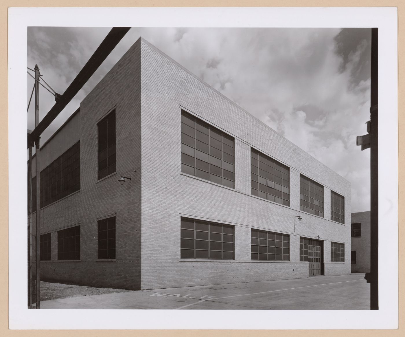View of the rear [?] façade of the Engineering Garage (also known as Building No. 135), Chrysler Corporation Highland Park Plant, Highland Park, Michigan