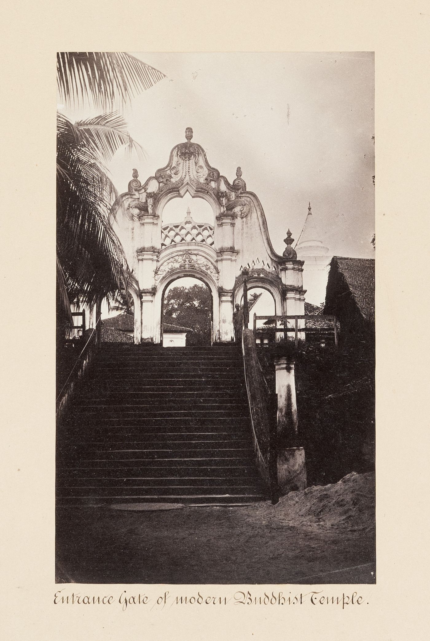 View of a staircase and the entrance gate of a Buddhist temple, near Colombo, Ceylon (now Sri Lanka)