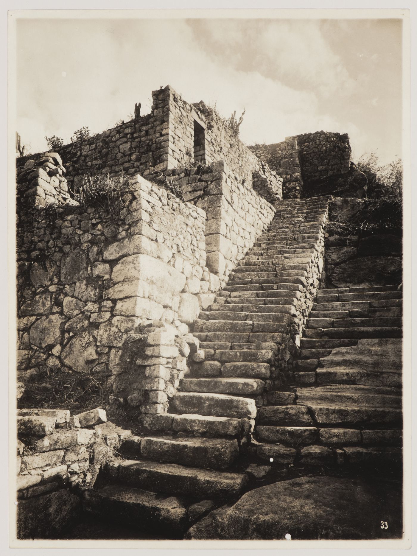 View of the upper portion of the Staircase of the Fountains with unidentified buildings on the left, Machu Picchu, Peru