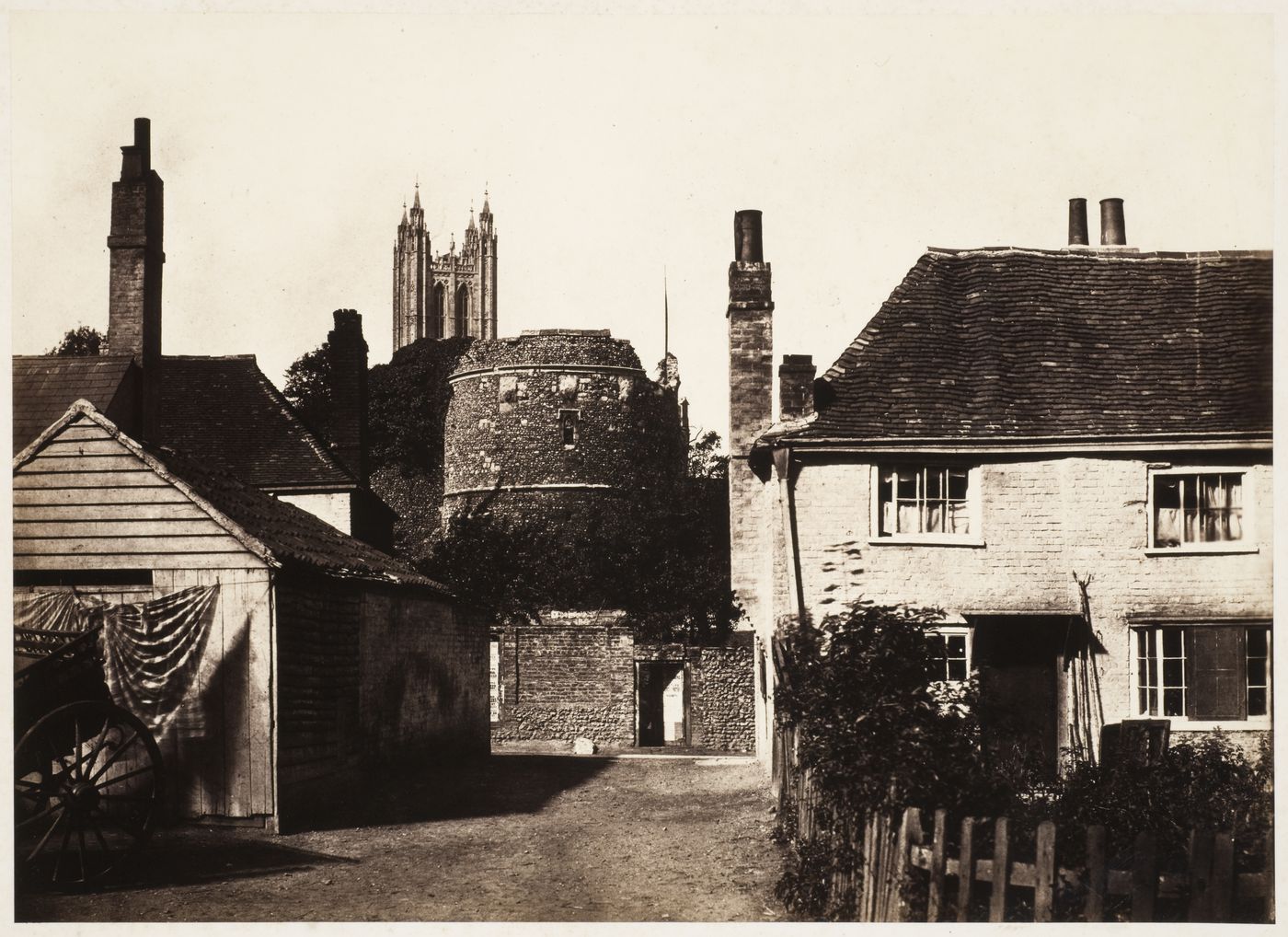 Canterbury Cathedral, Bell Harry Tower, and St. Augustine's Abbey, with houses and cart in foreground, Canterbury, England